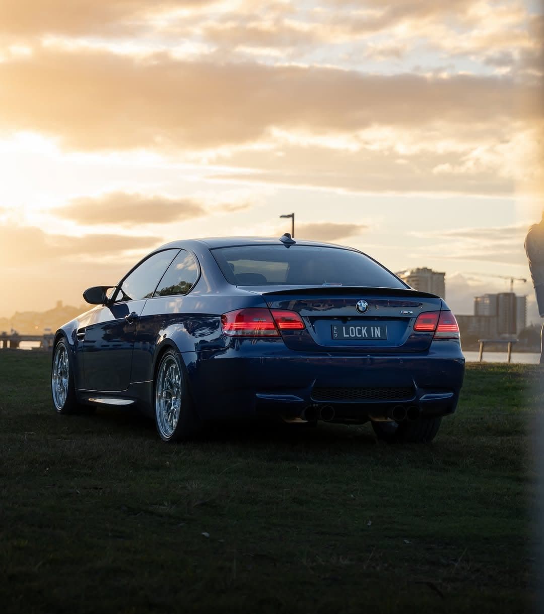 BMW E92 M3 rear three-quarter at sunset